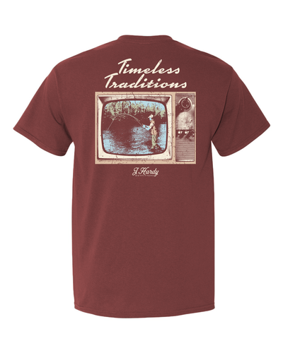 Celebrate the enduring legacy of fishing with the unique "Timeless Traditions" t-shirt! This classic-fit tee features a captivating design: a vintage television showcasing a classic fisherman. It's a symbolic tribute to the timeless allure of fishing, a tradition passed down through generations.